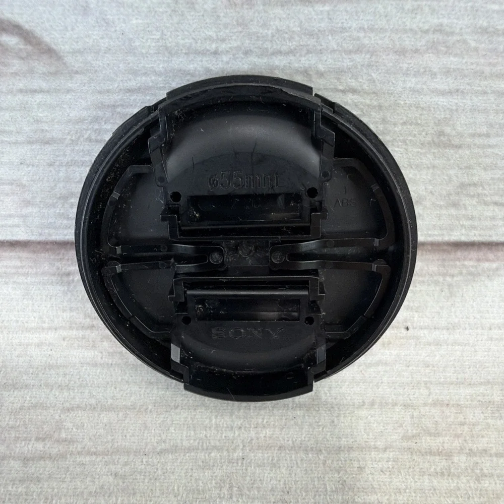 SONY ALPHA 55mm LENS FRONT COVER Black Genuine